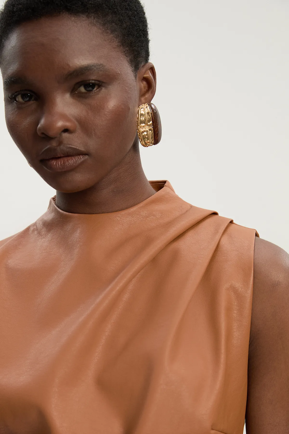 Faux Leather Drape Sleeveless Top BKK26091