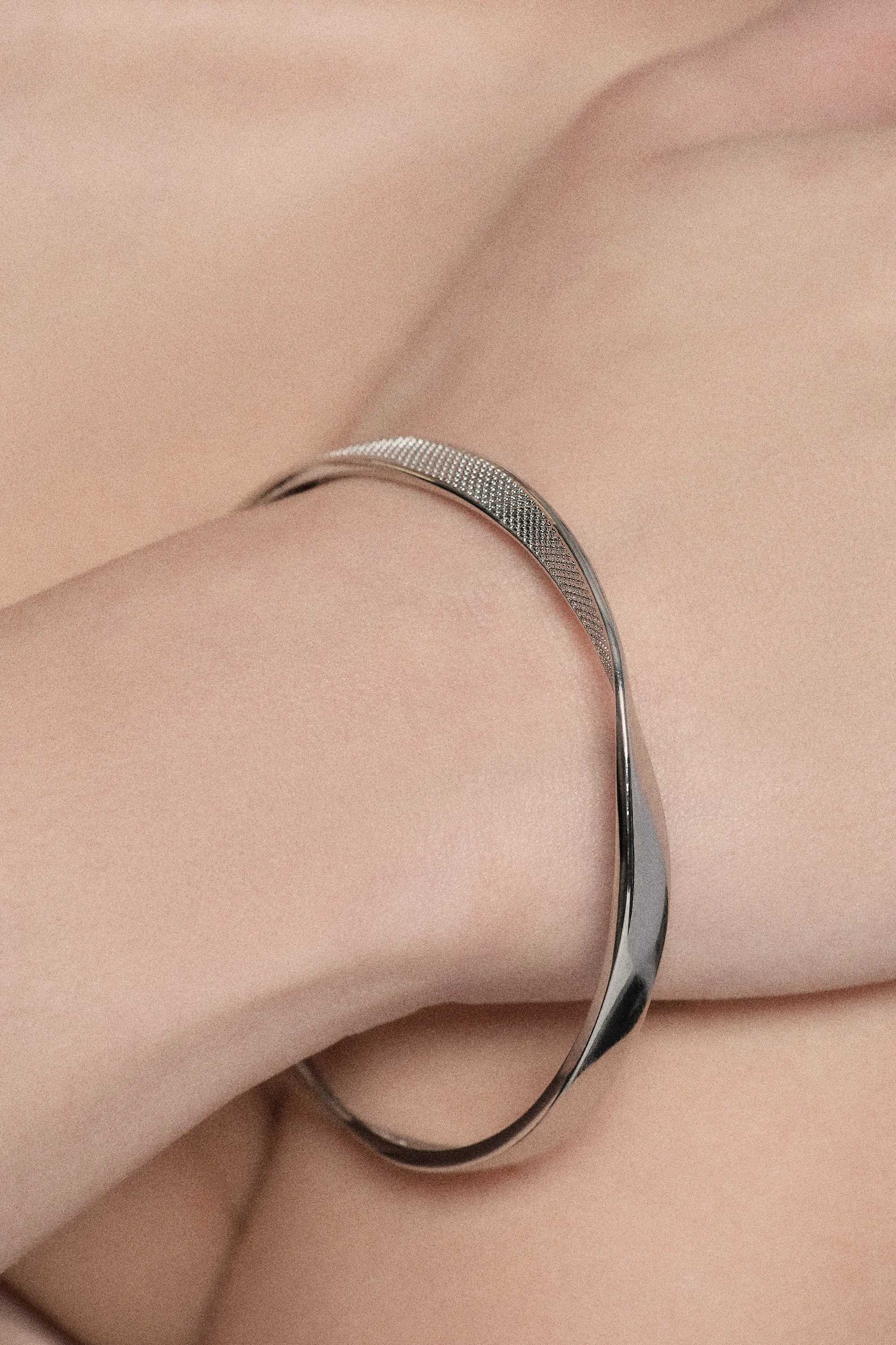 Silver Tone Textured Twist Narrow Bangle BKK24067
