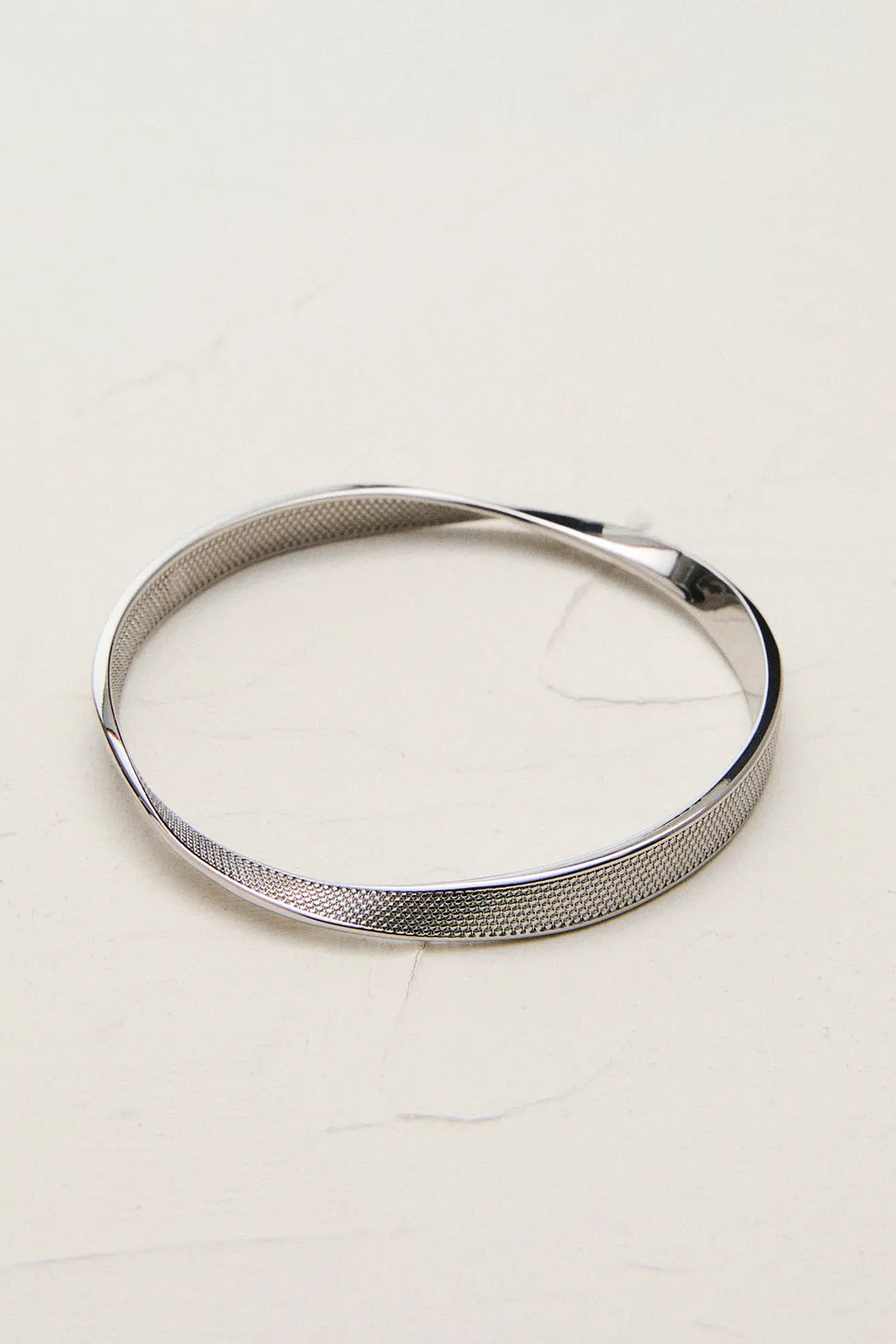 Silver Tone Textured Twist Narrow Bangle BKK24067