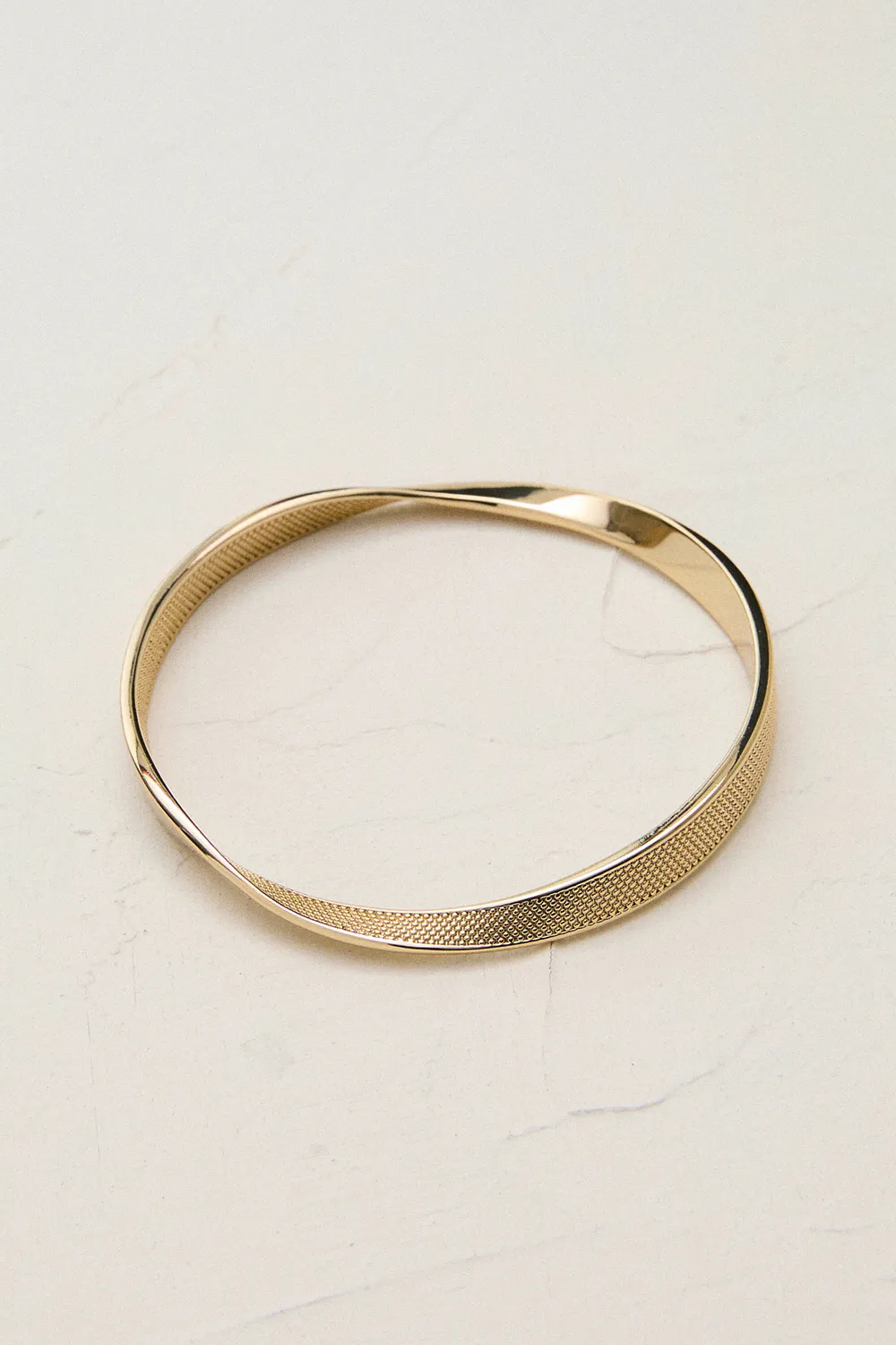 14kt Gold Plated Textured Twist Narrow Bangle BKK24068