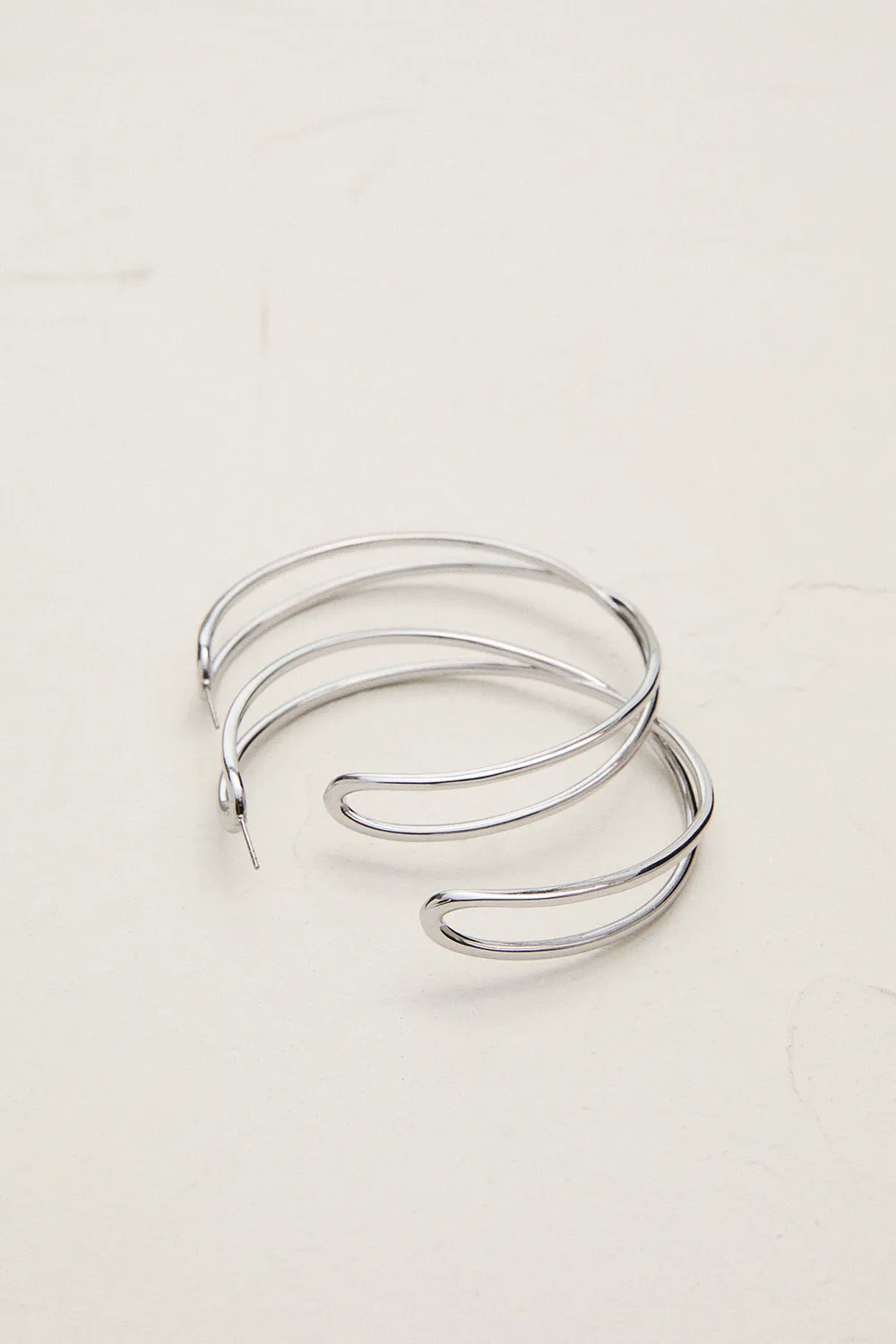 Silver Tone Criss Cross Hoop Earring BKK24079
